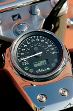 Tank-mounted instruments on the Aero are clean and simple, with only a digital odometer/tripmeter inside the speedo to keep you company. Tank-mounted instruments on the Aero are clean and simple, with only a digital odometer/tripmeter inside the speedo to keep you company.